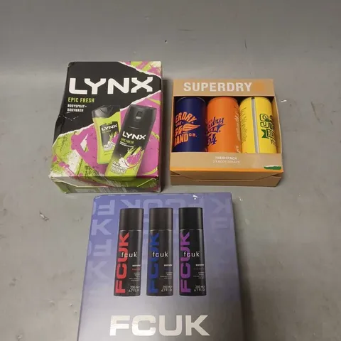 LOT OF 3 ASSORTED COSMETIC BOXSETS TO INCLUDE - LYNX EPIC FRESH DUO - SUPERDY FRESH PACK BODY SPRAYS - FCUK ONE OF EACH FRAGRANCE