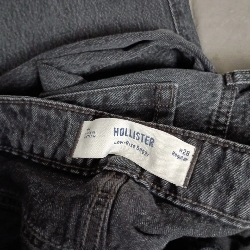 HOLLISTER BAGGY LOW-RISE JEANS – DARK DENIM, UK 10 (US W28)