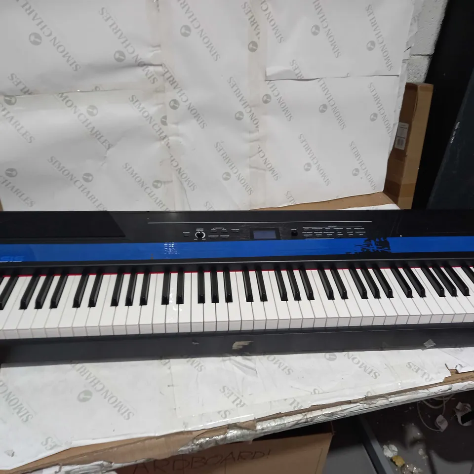 ALESIS RECITAL PRO DIGITAL PIANO/KEYBOARD WITH 88 HAMMER ACTION KEYS, 12 PREMIUM VOICES, 20W BUILT-IN SPEAKERS, HEADPHONE OUTPUT AND EDUCATIONAL FEATURES