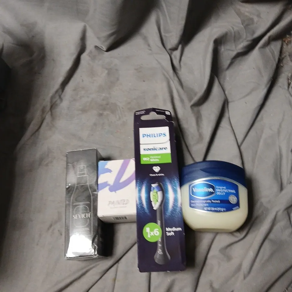 APPROXIMATELY 25 ITEMS INCLUDING ASSORTED HEALTH & BEAUTY PRODUCTS INCLUDING PHILIPS SONICARE REPLACEMENT HEADS VASELINE PAINTED BY JAMES CHARLES AND SEVICH .