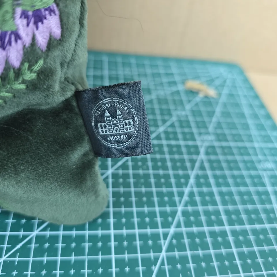 NATURAL HISTORY MUSEUM VELVET CUSHION – GREEN WITH LAVENDER SPRIGS