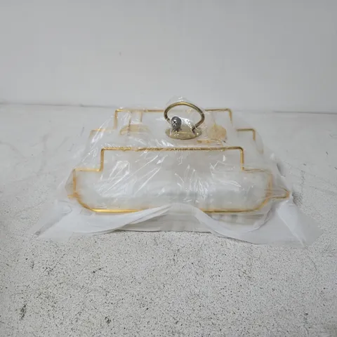 SNACK SERVING TRAY FEATURES A RECTANGULAR GLASS LID