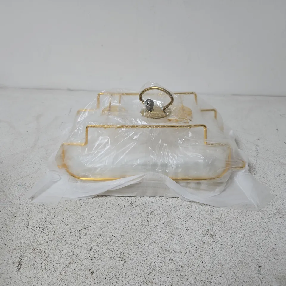 SNACK SERVING TRAY FEATURES A RECTANGULAR GLASS LID