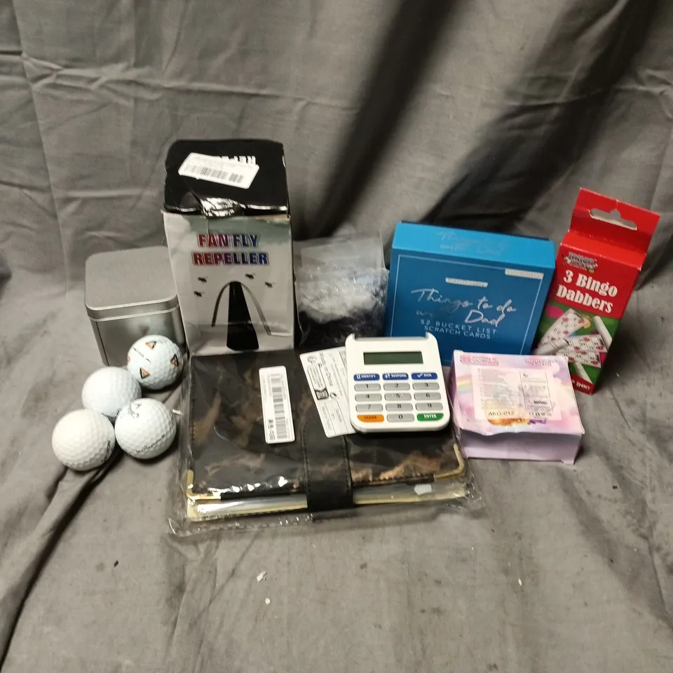 APPROXIMATELY 12 ASSORTED HOUSEHOLD ITEMS TO INCLUDE GOLF BALLS, FAN FLY REPELLER, BINGO DABBERS, ETC