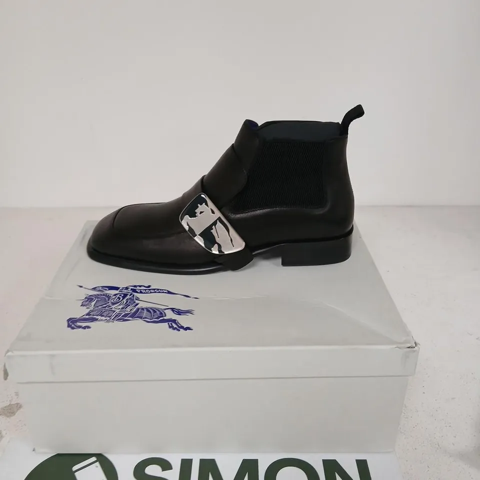 BURBERRY SHIELD BOOT – BLACK LEATHER CHELSEA BOOT WITH SILVER SHIELD BUCKLE, UK 11 (EU 45)