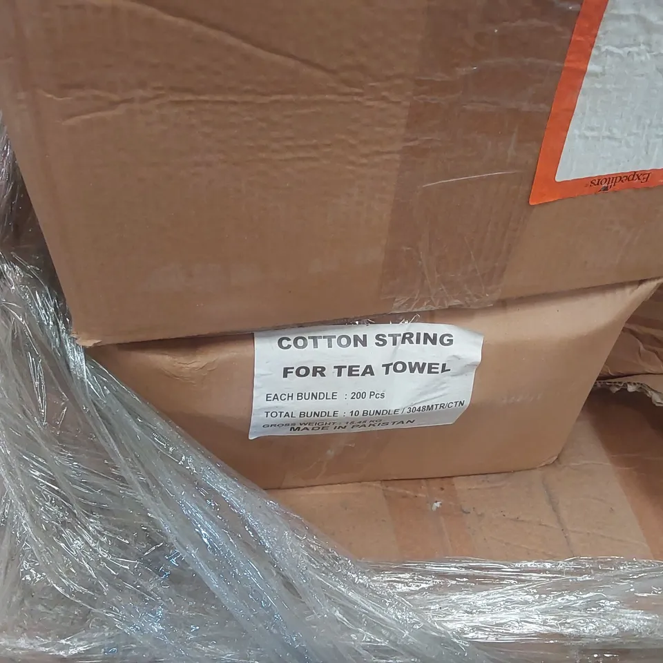 PALLET CONTAINING A VERY LARGE QUANTITY OF COTTON STRINGS FOR TEA TOWELS