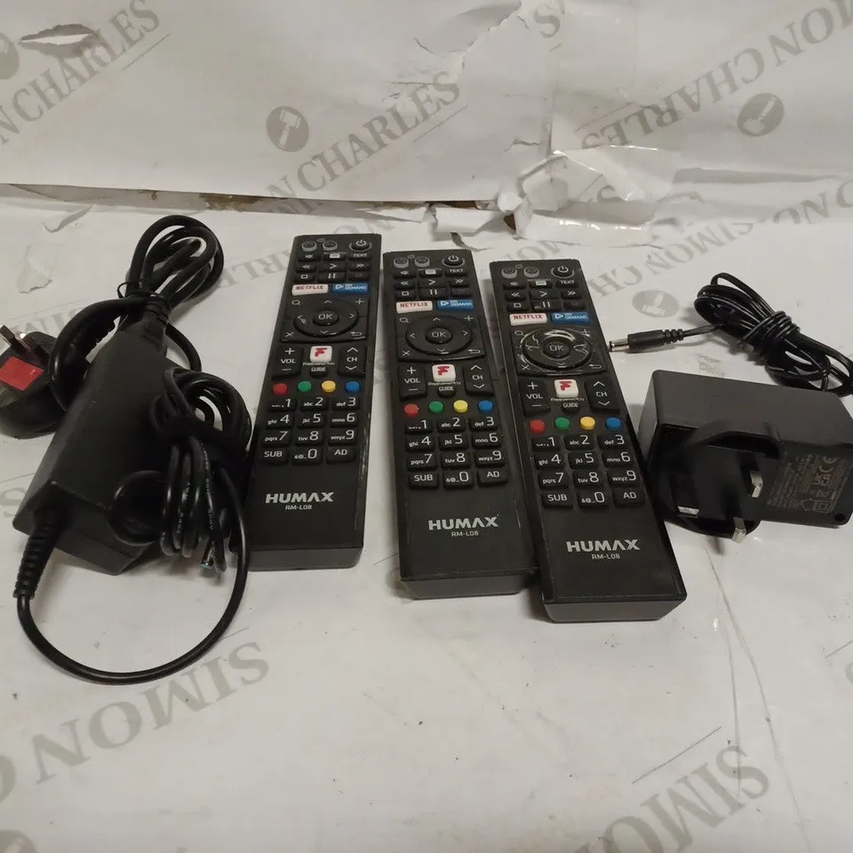 BOX OF ASSORTED ELECTRICALS INCLUDING 3 HUMAX REMOTES, SWITCHING ADAPTER