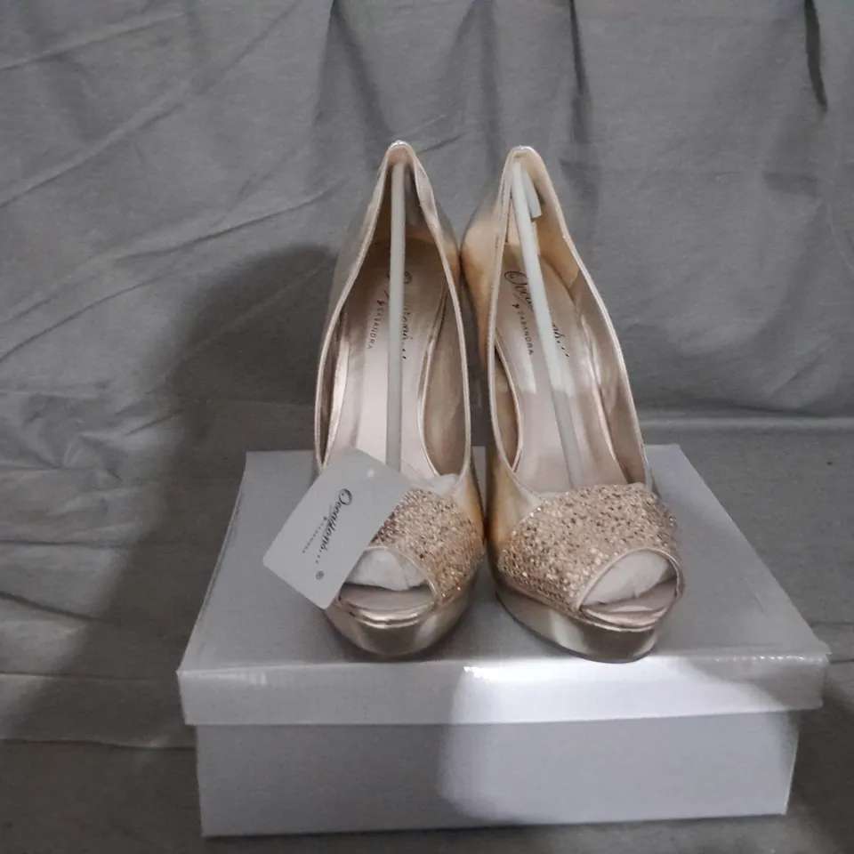 APPROXIMATELY 12 BOXED PAIR OF CASANDRA HEELED SANDALS IN GOLD VARIOUS SIZES