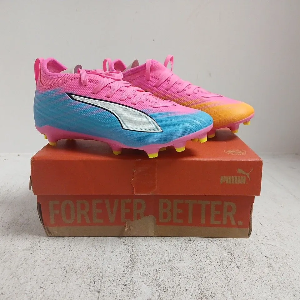 BOXED PAIR OF PUMA JUNIOR ULTRA 6 MATCH FIRM GROUND FOOTBALL BOOTS IN PINK/BLUE/ORANGE SIZE UK 1