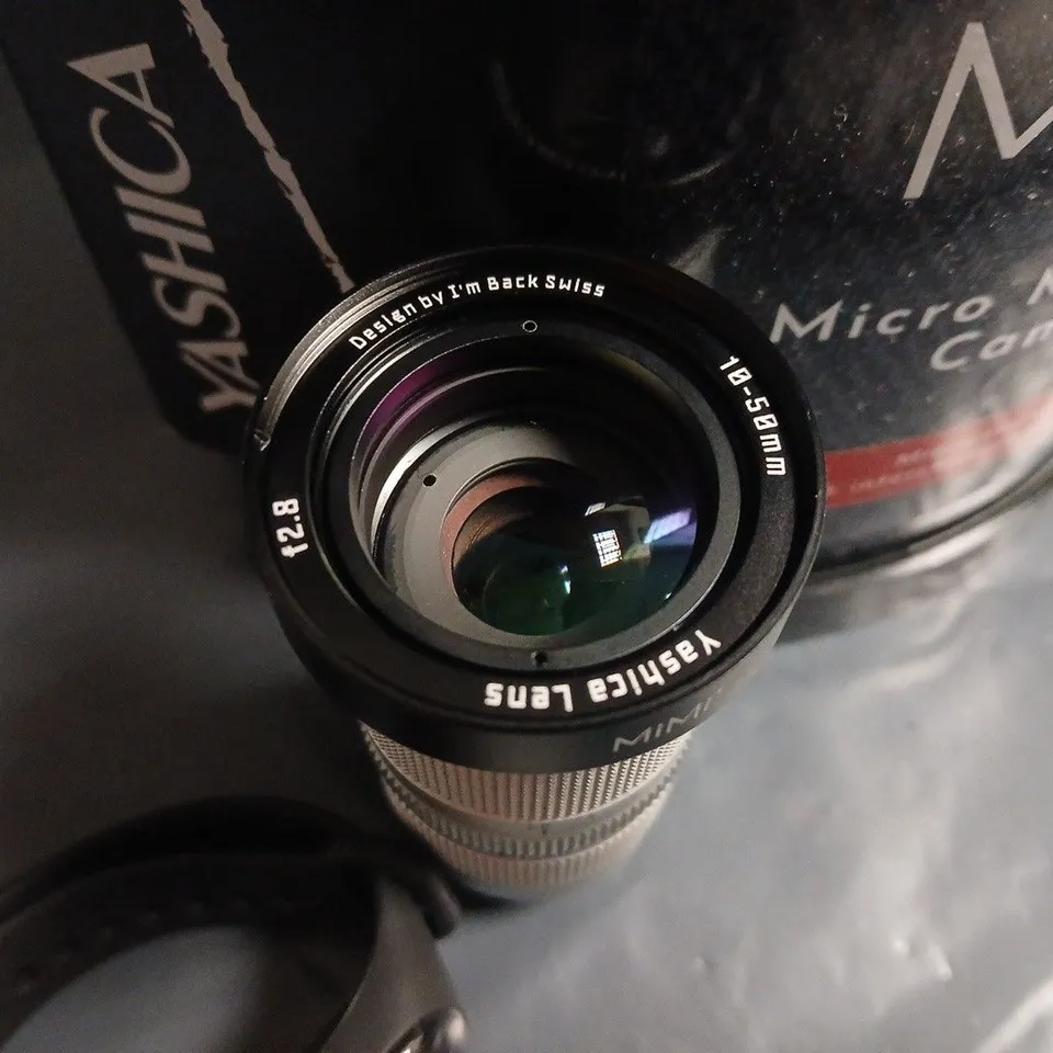 YASHICA MIMI MICRO MIRRORLESS CAMERA – WHITE WITH 3.9MM LENS AND BATTERY GRIP