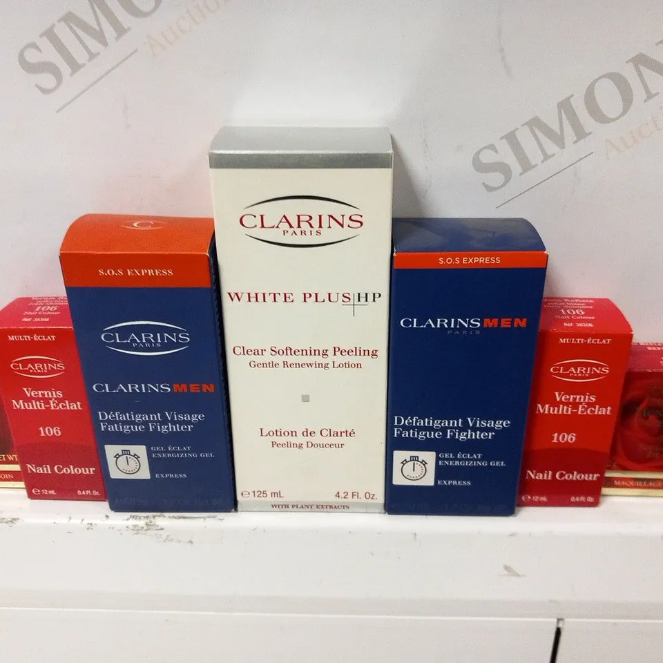 APPROXIMATELY 34 ASSORTED CLARINS PARIS COSMETICS PRODUCTS TO INCLUDE; NAIL COLOUR, SOFT SHIMMER EYE COLUR, FAIGUE FIGHTER, CLEAR SOFTENING PEELING GENTLE RENEWING LOTION AND AB FIRMING CREAM