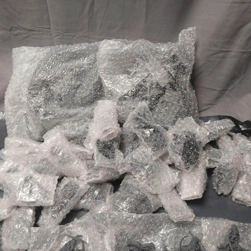 LOT OF ASSORTED WRAPPED UNPAINTED MINIATURE FIGURINES