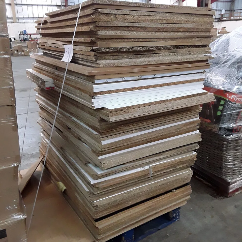 PALLET OF APPROXIMATELY 77 PARTICLE BOARDS