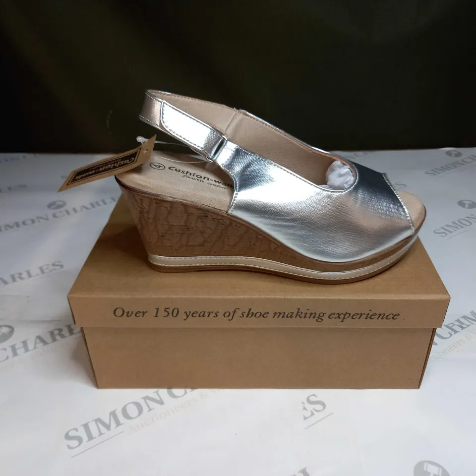 BOXED PAIR OF CUSHION WALK SILVER WEDGE HEELED SHOES - SIZE 4