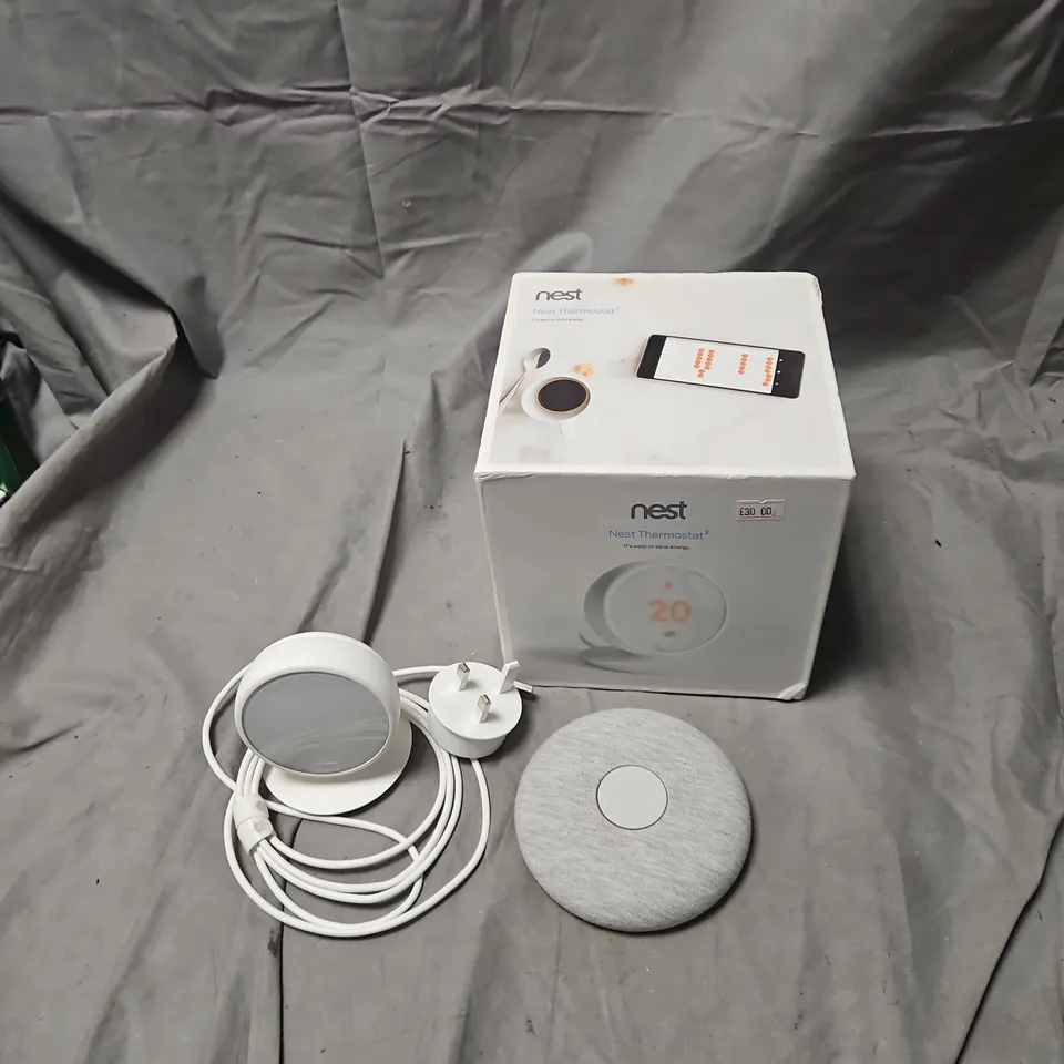 NEST THERMOSTAT E – BOXED WITH POWER ADAPTER AND FABRIC-COVERED THERMOSTAT .
