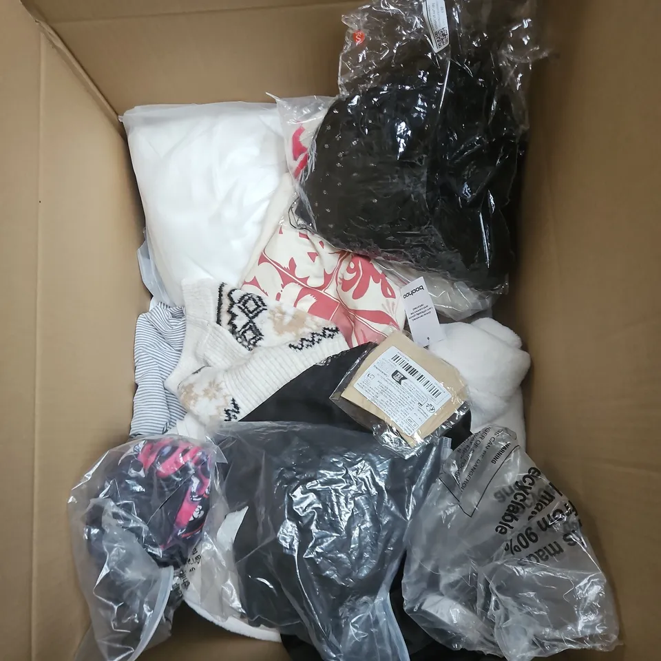 BOX OF APPROXIMATELY 25 ASSORTED CLOTHING ITEMS TO INCLUDE RED SEQUIN DRESS, WICKED SOCKS, BLUE JOGGERS, COMEDY T SHIRT ETC