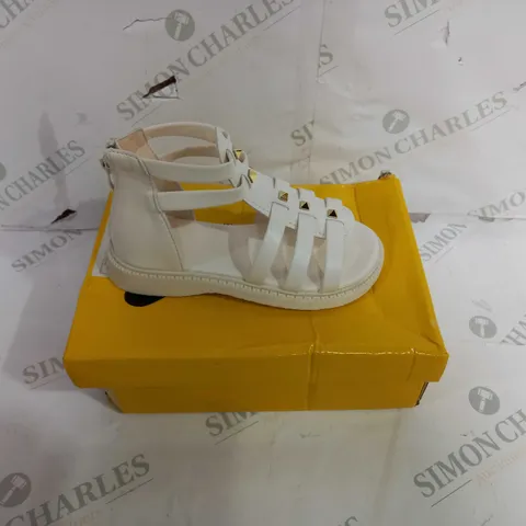BOXED PAIR OF SANDALS WITH REAR ZIP, IN CREAM. SIZE UNSPECIFIED