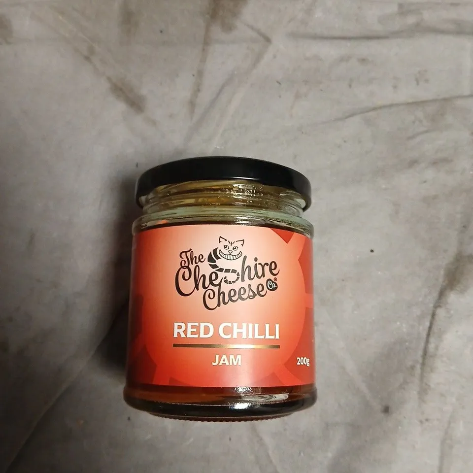 APPROXIMATELY 15 ASSORTED FOOD ITEMS INCLUDING THE CHESHIRE CHEESE SAVOURY BISCUITS , RED CHILLI JAM AND MILK CHOCOLATE BUTTONS