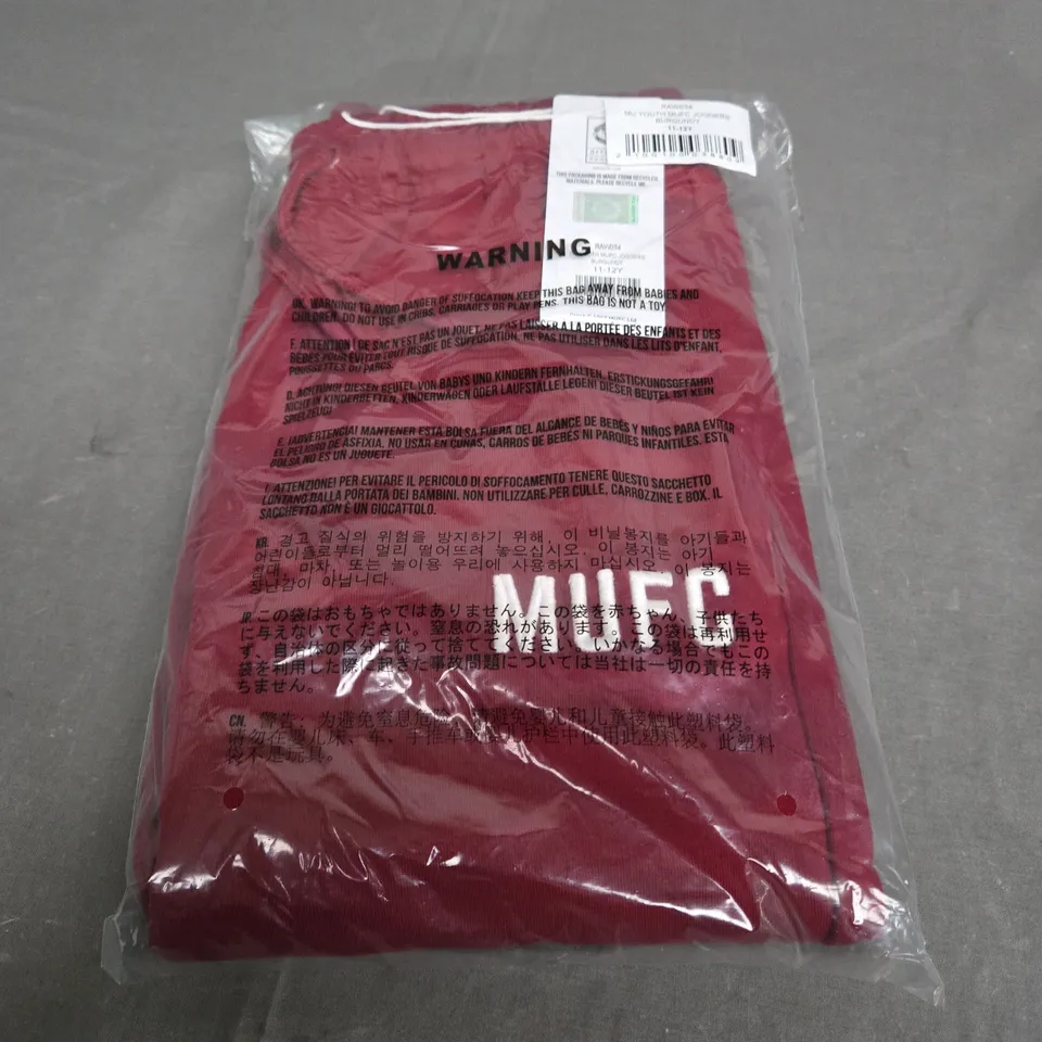 SEALED MANCHESTER UNITED JOGGERS IN BURGUNDY - SIZE 11-12 YEARS