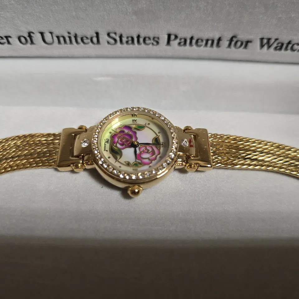 MARCEL DRUCKER GOLD TONE WRISTWATCH WITH FLORAL FACE
