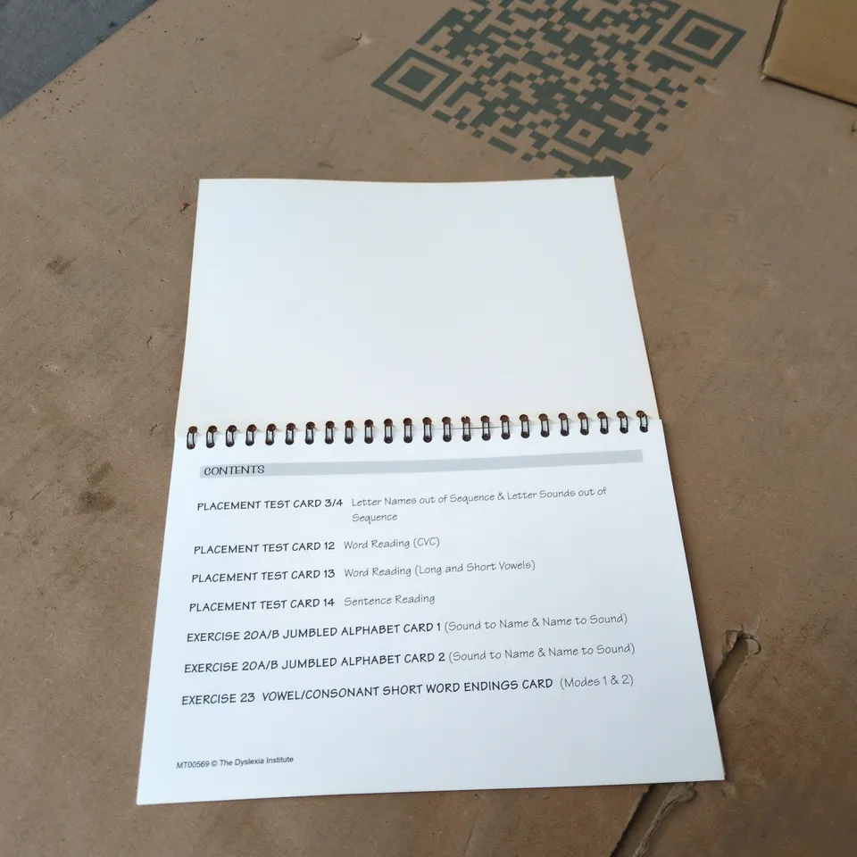 BOX OF APPROXIMATELY 30 BRAND NEW ACTIVE LITERACY KITS (PLACEMENT TEST AND EXERCISE CARDS)