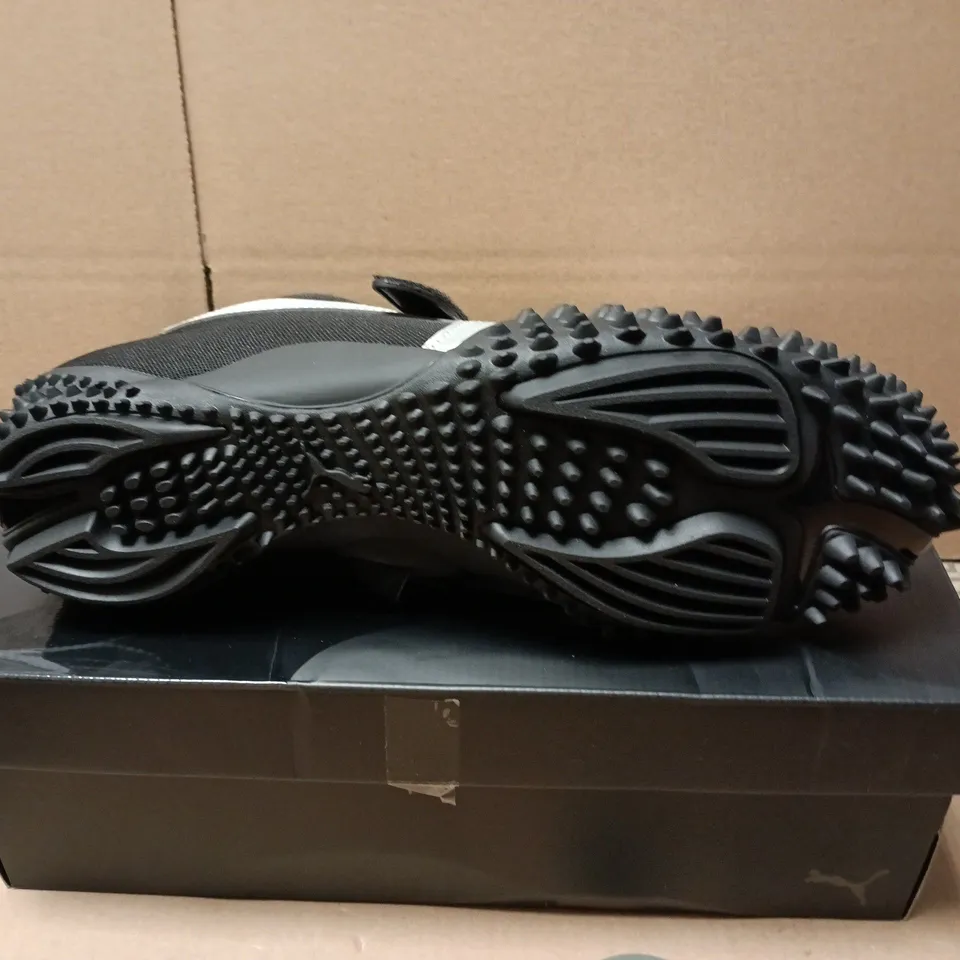 BOXED PAIR OF PUMA MOSTRO OG TRAINERS IN BLACK - UK 12
