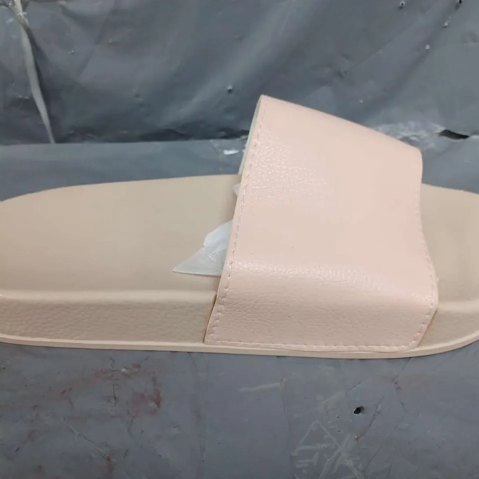 APPROXIMATELY 12 A SLIP ON SLIDERS IN PINK IN VARIOUS SIZES
