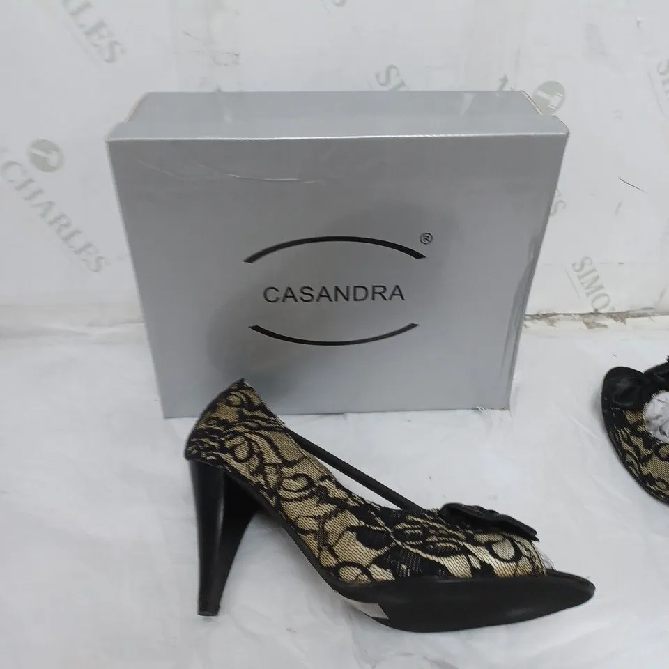 LARGE BOX OF BOXED APPROXIMATELY 10 CASSANDRA OPEN TOE HEELS IN BLACK/SAND IN VARIOUS SIZES