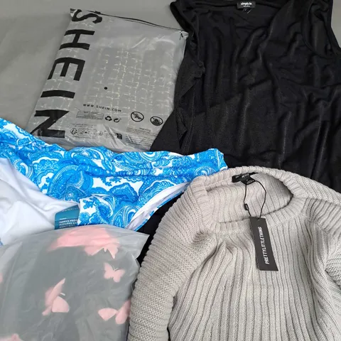 APPROXIMATELY 25 ASSORTED CLOTHING ITEMS IN VARIOUS SIZES TO INCLUDE BRIEFS, DRESSES, SWEATER, ETC
