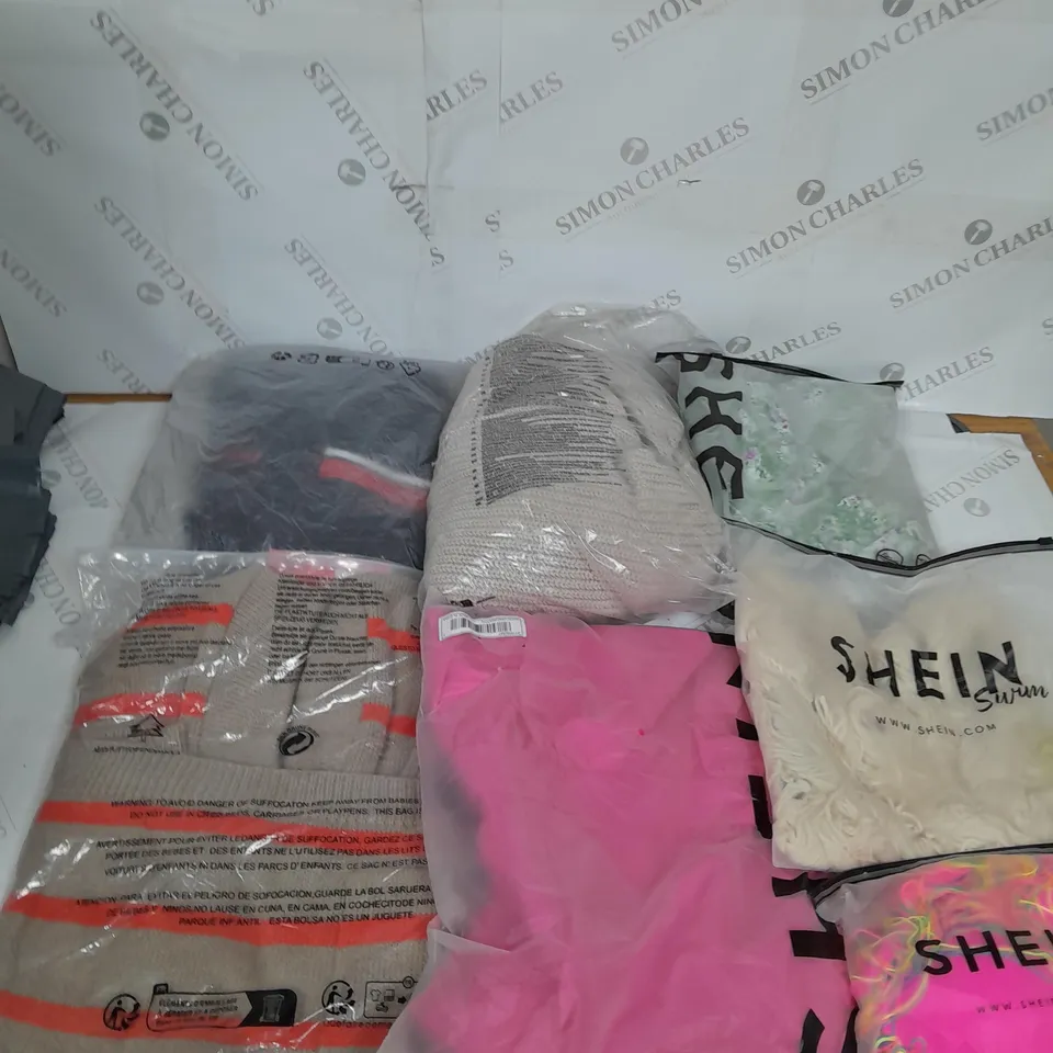 LARGE BOX OF ASSORTED CLOTHING ITEMS IN VARIOUS COLOURS AND SIZES INCLUDING TROUSERS , TOPS AND JUMPERS 