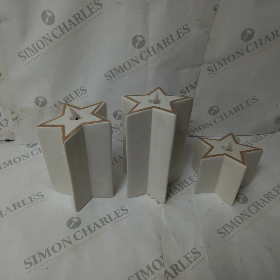BOXED OUTLET HOME REFLECTIONS CERAMIC STAR PRE-LIT CANDLES