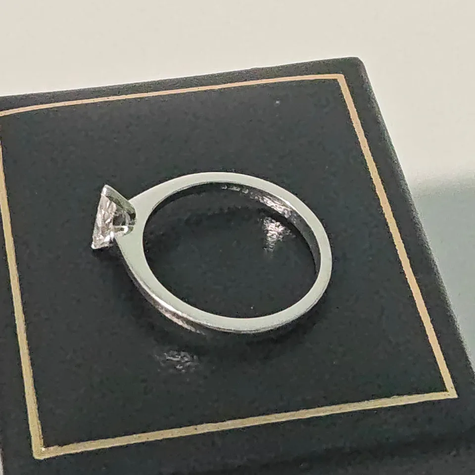 18CT WHITE GOLD SOLITAIRE RING SET WITH A MARQUISE CUT NATURAL DIAMOND