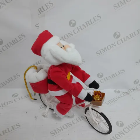 MR CHRISTMAS PRE-LIT MUSICAL CYCLING SANTA