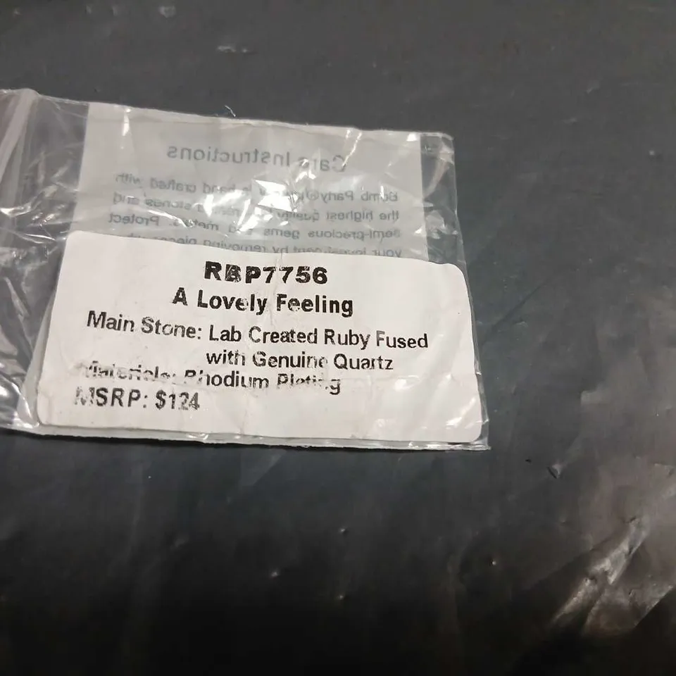 A LOVELY FEELING RING WITH RED LAB-CREATED RUBY FUSED WITH GENUINE QUARTZ – PAVÉ-SET SILVER-TONE