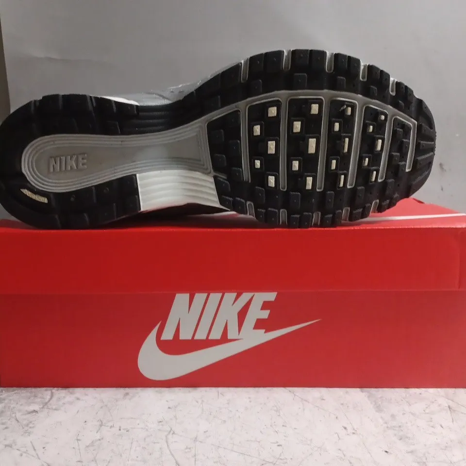 BOXED PAIR OF NIKE P-6000 TRAINERS IN METALLIC SILVER SIZE UK 9