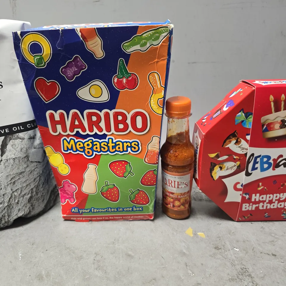 APPROXIMATELY 8 ASSORTED FOOD ITEMS TO INCLUDE - CELEBRATIONS , HARIBO MEGASTARS , OLIVE OIL ETC