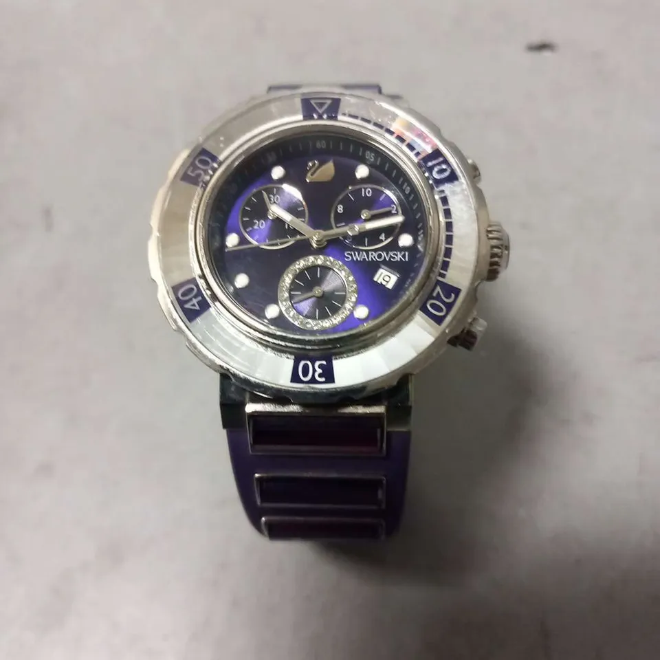 SWAROVSKI 1088675 STAINLESS STEEL 50M SWISS MADE WRIST WATCH AND PURPLE RUBBER STRAP 