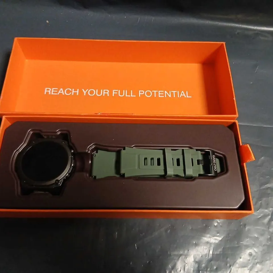 GARD PRO SMARTWATCH WITH OLIVE-GREEN STRAP IN ORANGE BOX