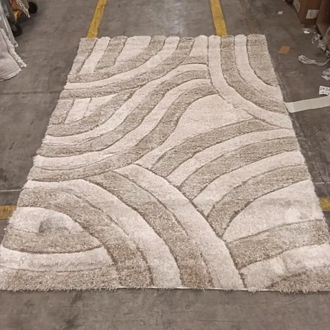 SHAGGY AREA RUG WITH BEIGE AND BROWN ABSTRACT CURVED PATTERN APPROXIMATELY 238 CM X 166 CM