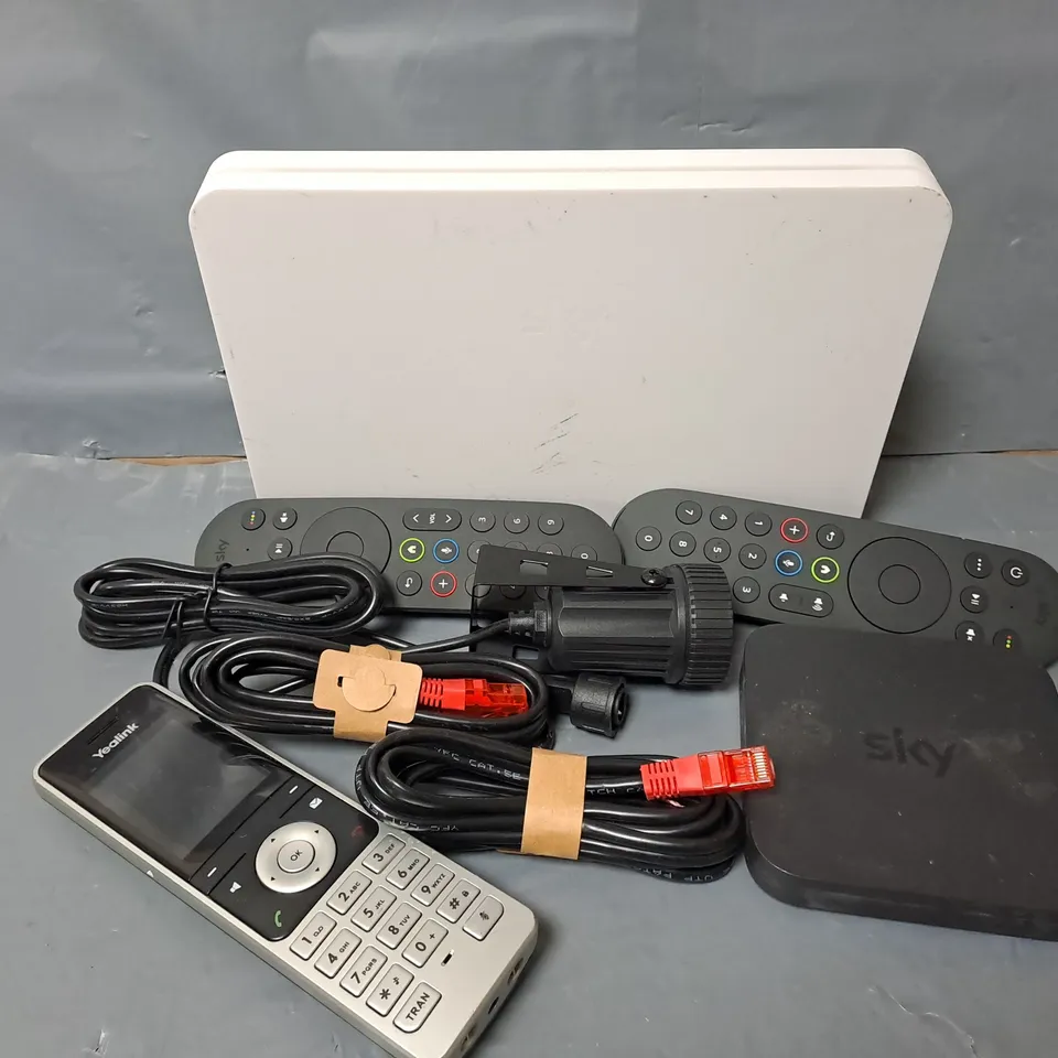 APPROXIMATELY 12 ASSORTED HOUSEHOLD ITEMS TO INCLUDE CABLES, TV REMOTES, PHONE, ETC