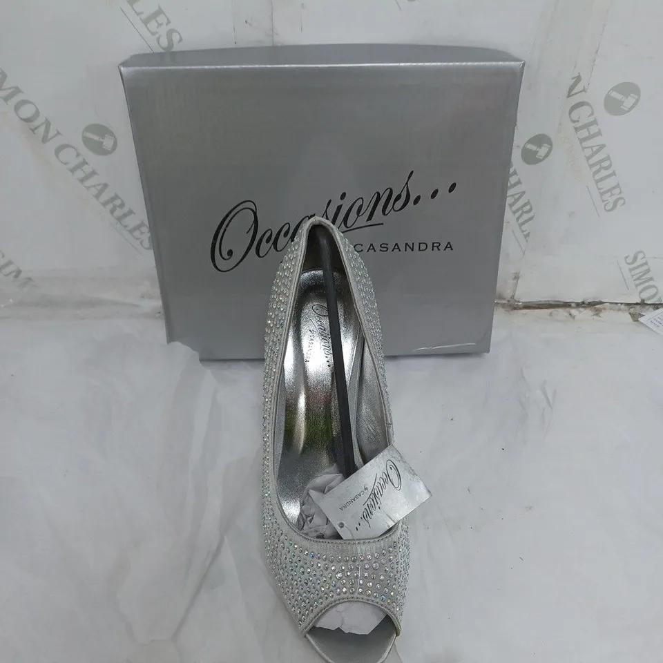LARGE BOX OF APPROXIMATELY 10 BOXED OCCASIONS BY CASANDRA JEWELLED SILVER OPEN TOE HEELS IN VARIOUS SIZES 