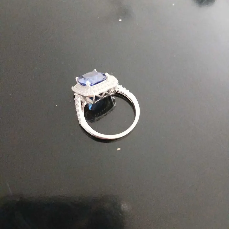 STERLING SILVER RHODIUM PLATED DQ TANZANITE HALO RING
