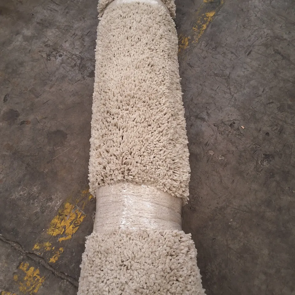 ROLLED WHITE SHAGGY RUG - APPROXIMATELY 235CM X UNSPECIFIED 
