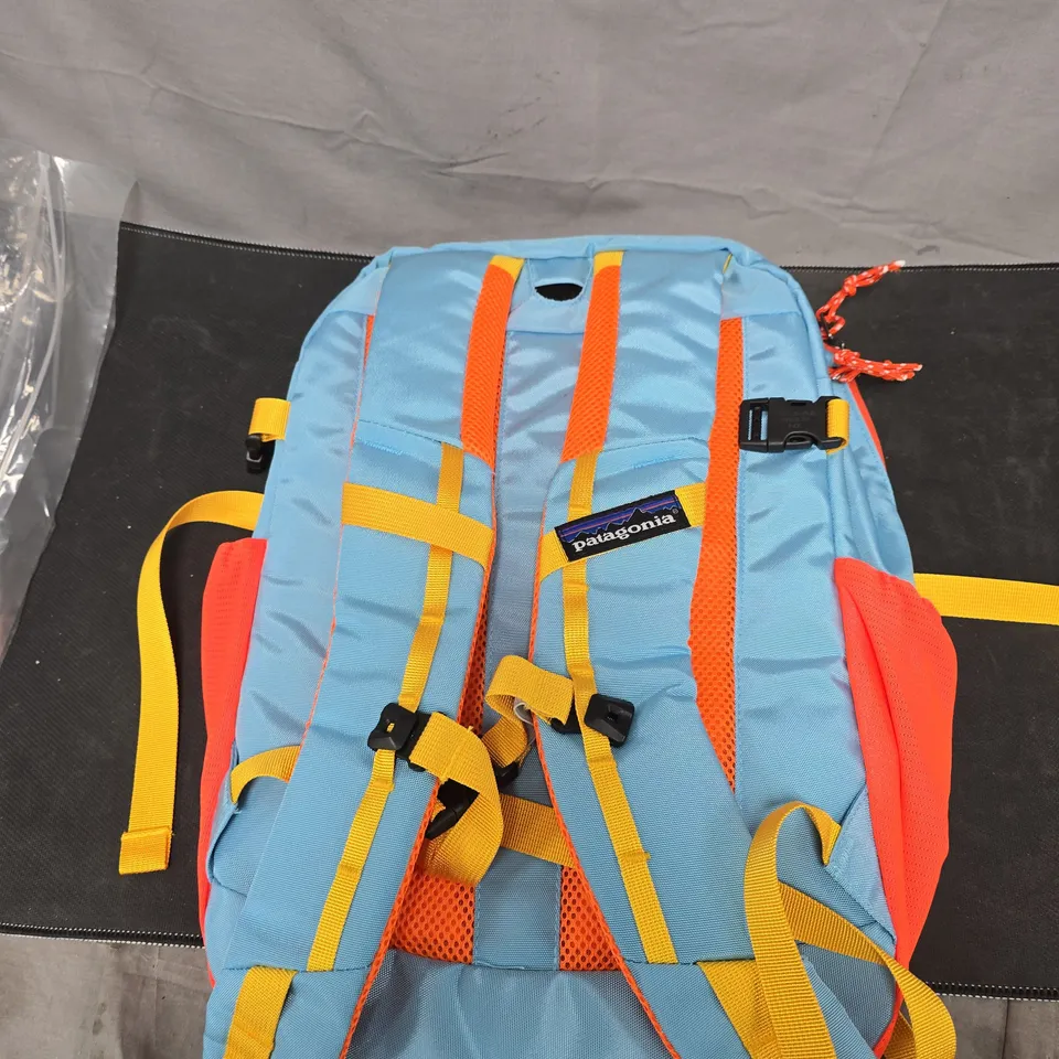 PATAGONIA BACKPACK – LIGHT BLUE WITH ORANGE PANELS AND YELLOW STRAPS