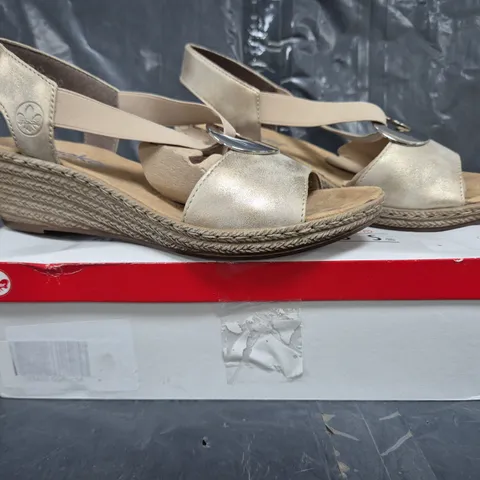 BOXED PAIR OF RIEKER OPEN TOE WEDGE SANDALS IN GOLD SIZE 6.5