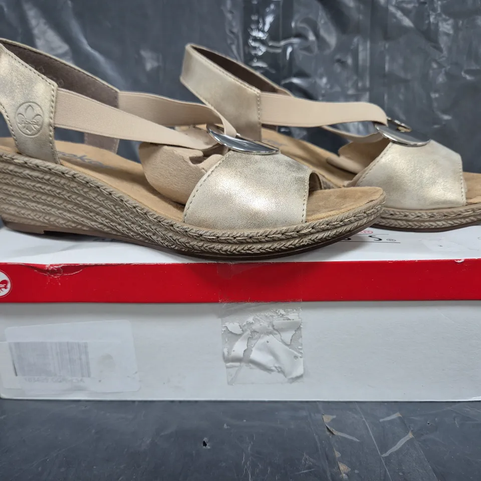 BOXED PAIR OF RIEKER OPEN TOE WEDGE SANDALS IN GOLD SIZE 6.5