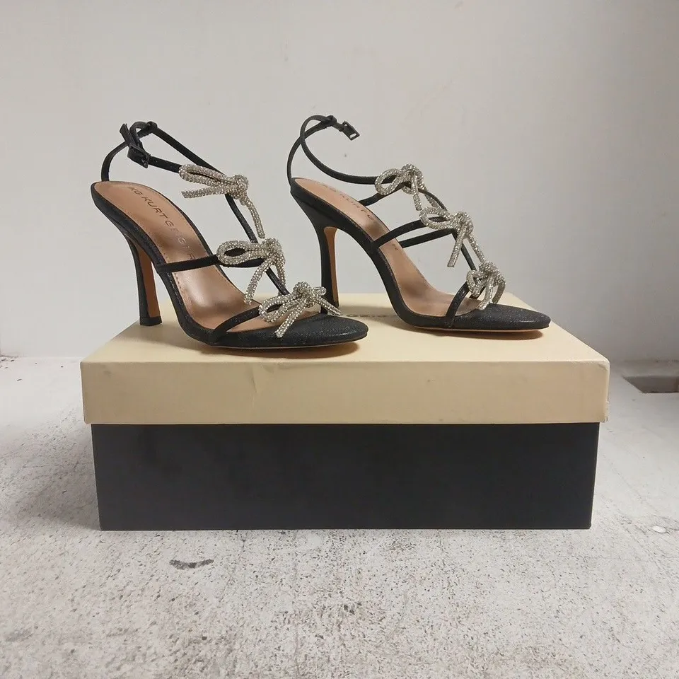 BOXED PAIR OF KURT GEIGER OPEN TOE HEELS IN BLACK GLITTER W. JEWEL EFFECT BOW DETAIL SIZE EU 37