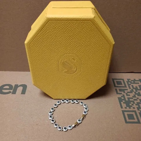 BOXED SWAROVSKI SILVER-TONE BRACELET WITH BLUE STONES IN ROUND BEZEL LINKS