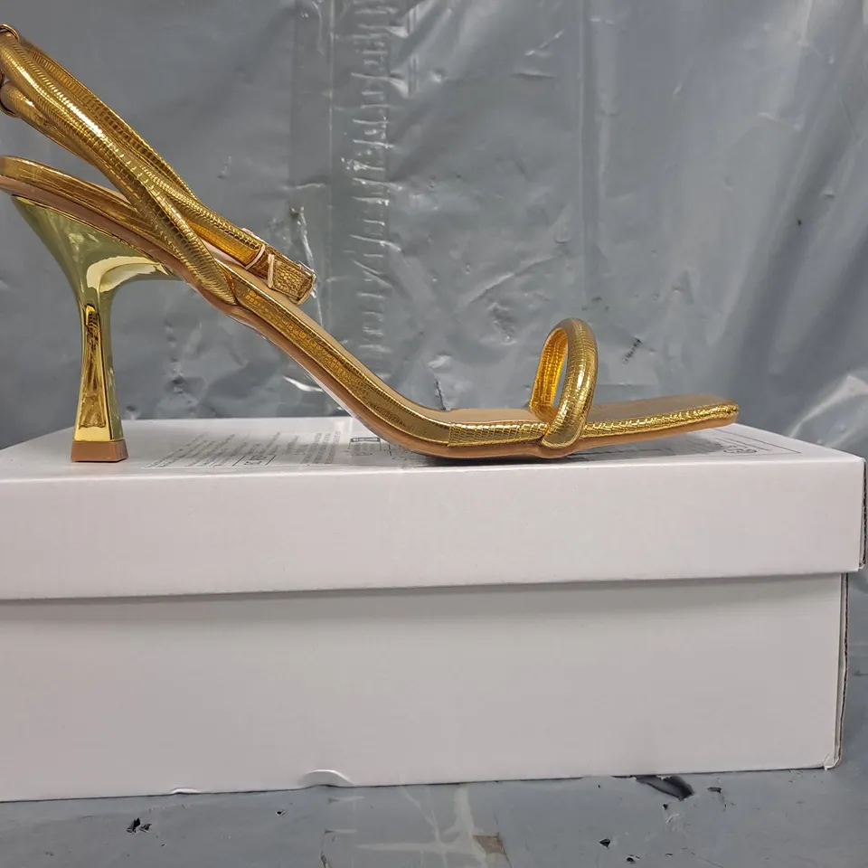 BOXED PAIR OF UNBRANDED OPEN TOE STRAPPY HEELED SANDALS IN METALLIC GOLD SIZE EU 42