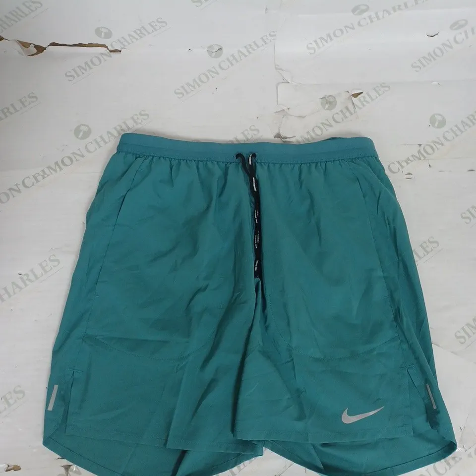 NIKE RUNNING SHORTS IN GREEN SIZE M